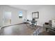 Bright, minimalist office space with modern wood floors, natural light, and a desk area at 806 7Th St, Columbus, IN 47201