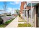 Pristine townhome exteriors with minimalist landscaping and sidewalks, offering a modern and walkable community at 806 7Th St, Columbus, IN 47201