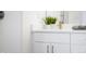 Bright bathroom vanity featuring a modern faucet, clean white countertop, and greenery at 822 7Th St, Columbus, IN 47201