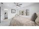 Bright bedroom with large window, fan, and neutral decor at 822 7Th St, Columbus, IN 47201