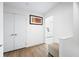 Hallway with hardwood floors, closet, and doorway to the bedroom at 822 7Th St, Columbus, IN 47201