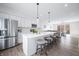 Open-concept kitchen featuring a large island with seating and modern appliances at 822 7Th St, Columbus, IN 47201
