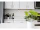 Modern kitchen details include white cabinets, decor, and stainless microwave at 822 7Th St, Columbus, IN 47201