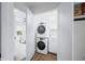 New laundry room with stacked washer and dryer and modern design at 822 7Th St, Columbus, IN 47201