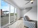 Cozy living room with floor-to-ceiling glass doors to balcony and staircase at 822 7Th St, Columbus, IN 47201
