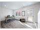 Home office with rustic desk, plank floors and a glass door to exterior at 822 7Th St, Columbus, IN 47201