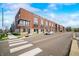 Street view showcasing modern townhomes with private balconies and well-manicured lawns at 822 7Th St, Columbus, IN 47201