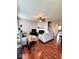 Spacious living room showcasing a fireplace, ceiling fan, and hardwood flooring at 6343 Central Blvd, Whitestown, IN 46075