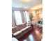 Cozy living room featuring a comfortable sofa, hardwood floors, and a bright chandelier at 6343 Central Blvd, Whitestown, IN 46075