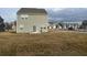 View of a backyard with a sliding glass door and a grill at 696 Scarsdale Ln, Danville, IN 46122