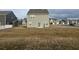 Photo of backyard with a house, sliding glass door and a grill at 696 Scarsdale Ln, Danville, IN 46122