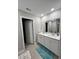 Bright bathroom with double sinks, a large mirror, and modern fixtures at 696 Scarsdale Ln, Danville, IN 46122