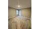 Spacious bedroom with neutral walls, large window, and carpeted floor at 696 Scarsdale Ln, Danville, IN 46122