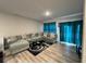 Inviting living room featuring a large sectional sofa and stylish décor at 696 Scarsdale Ln, Danville, IN 46122