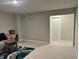 Cozy living room featuring a sofa, a modern rug, and a white paneled door at 696 Scarsdale Ln, Danville, IN 46122
