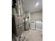 Utility room featuring a furnace, hot water tank, and a side-by-side washer and dryer at 696 Scarsdale Ln, Danville, IN 46122