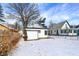 Backyard with snow featuring the garage and trees at 5845 Rawles Ave, Indianapolis, IN 46219