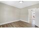 Bright room featuring wood-look floors, and a window with natural light at 5845 Rawles Ave, Indianapolis, IN 46219