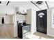 Kitchen featuring a stainless steel oven and a view into the living room at 5845 Rawles Ave, Indianapolis, IN 46219