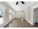 Spacious living room featuring hardwood floors, lots of natural light, and neutral paint at 5845 Rawles Ave, Indianapolis, IN 46219