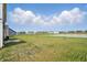 Expansive backyard view showcasing the green space, landscaping, and pond in the community at 211 Walker Dr, Whiteland, IN 46184