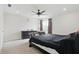 Light-filled bedroom with a ceiling fan and calming, neutral decor at 211 Walker Dr, Whiteland, IN 46184
