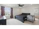 Comfortable bedroom featuring a window, ceiling fan, and neutral carpeting at 211 Walker Dr, Whiteland, IN 46184