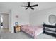 Bright bedroom with gray carpet and a fan, creating a welcoming space at 211 Walker Dr, Whiteland, IN 46184