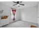 Bright bedroom with a ceiling fan, a window, and decorated with butterfly wall decals at 211 Walker Dr, Whiteland, IN 46184