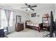 Bright bedroom featuring plush carpet, ceiling fan, and decoratively adorned with toys and colorful accents at 211 Walker Dr, Whiteland, IN 46184