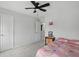 Cozy bedroom featuring plush carpet and a ceiling fan fixture at 211 Walker Dr, Whiteland, IN 46184