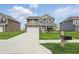 Two-story home featuring a well-manicured lawn and mailbox at 211 Walker Dr, Whiteland, IN 46184