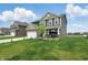 Two-story home featuring a well-manicured lawn and attached two-car garage at 211 Walker Dr, Whiteland, IN 46184