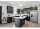 Stylish kitchen boasts stainless steel appliances and an island at 211 Walker Dr, Whiteland, IN 46184