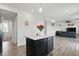 Open-concept kitchen showcases an island and flows into living space at 211 Walker Dr, Whiteland, IN 46184