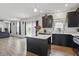 Open concept kitchen with island and views of the living area at 211 Walker Dr, Whiteland, IN 46184