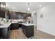 Modern kitchen featuring stainless appliances, island, and ample cabinetry at 211 Walker Dr, Whiteland, IN 46184