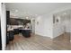 Well-lit kitchen featuring stainless steel appliances, an island, and dark cabinets at 211 Walker Dr, Whiteland, IN 46184