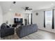 Comfortable living room featuring modern furniture, a ceiling fan, and natural light at 211 Walker Dr, Whiteland, IN 46184