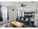 Cozy living room with ceiling fan, modern furniture and access to the kitchen at 211 Walker Dr, Whiteland, IN 46184