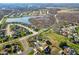 Aerial view of a beautiful community with a lake and many houses at 6093 Boulder Ct, Columbus, IN 47201