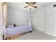 Light and airy bedroom with ceiling fan and double-door closet at 6093 Boulder Ct, Columbus, IN 47201