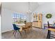 Charming dining area with yellow and white checkered tablecloth and wood furniture at 6093 Boulder Ct, Columbus, IN 47201