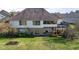 Two-story house with deck, screened porch, and large backyard at 6093 Boulder Ct, Columbus, IN 47201