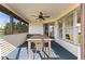 Screened porch with table and chairs, access to backyard at 6093 Boulder Ct, Columbus, IN 47201