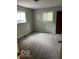 Spacious bedroom with neutral walls and carpet at 2456 Beechcrest Dr, Indianapolis, IN 46203