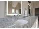 Bathroom features a double vanity with granite countertops and modern sinks at 5286 Stonehaven Ln, Columbus, IN 47201