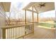 Spacious deck with wooden flooring and metal railing, overlooking a backyard at 5286 Stonehaven Ln, Columbus, IN 47201