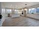 Open kitchen with island, stainless steel appliances, and white cabinetry at 5286 Stonehaven Ln, Columbus, IN 47201