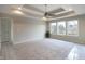 Spacious main bedroom with tray ceiling and ample natural light at 5286 Stonehaven Ln, Columbus, IN 47201
